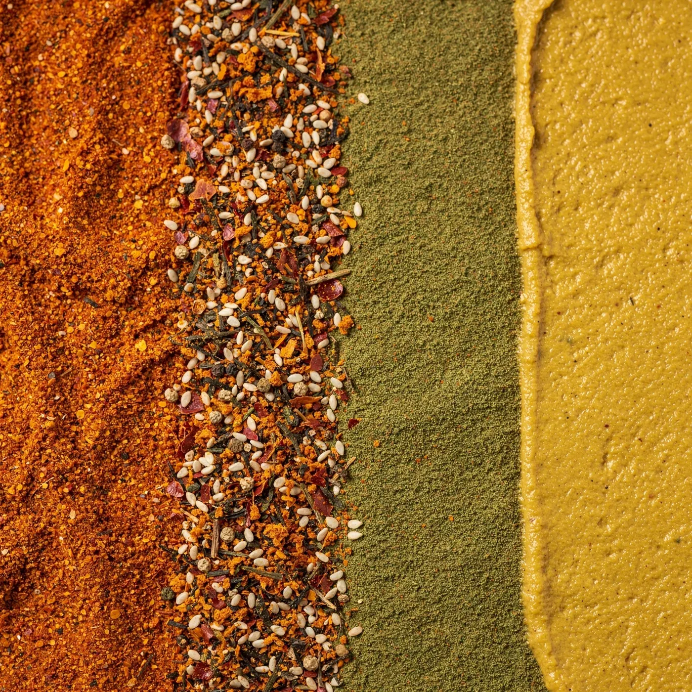 Four Japanese spices side by side: ichimi, shichimi, sansho, and karashi