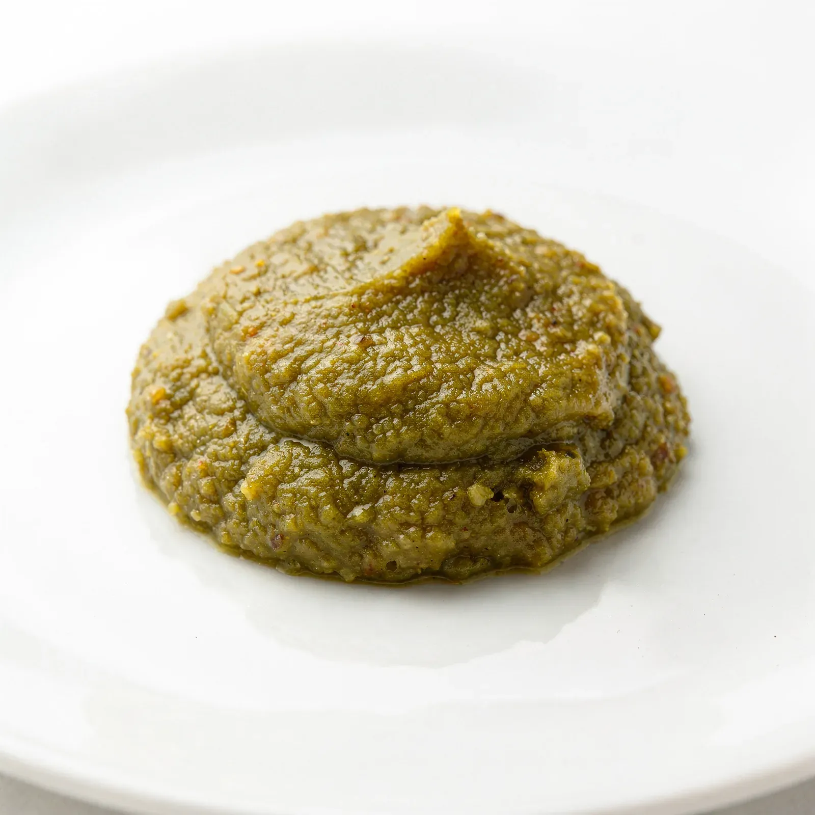 Green yuzu kosho with visibly chopped citrus peel